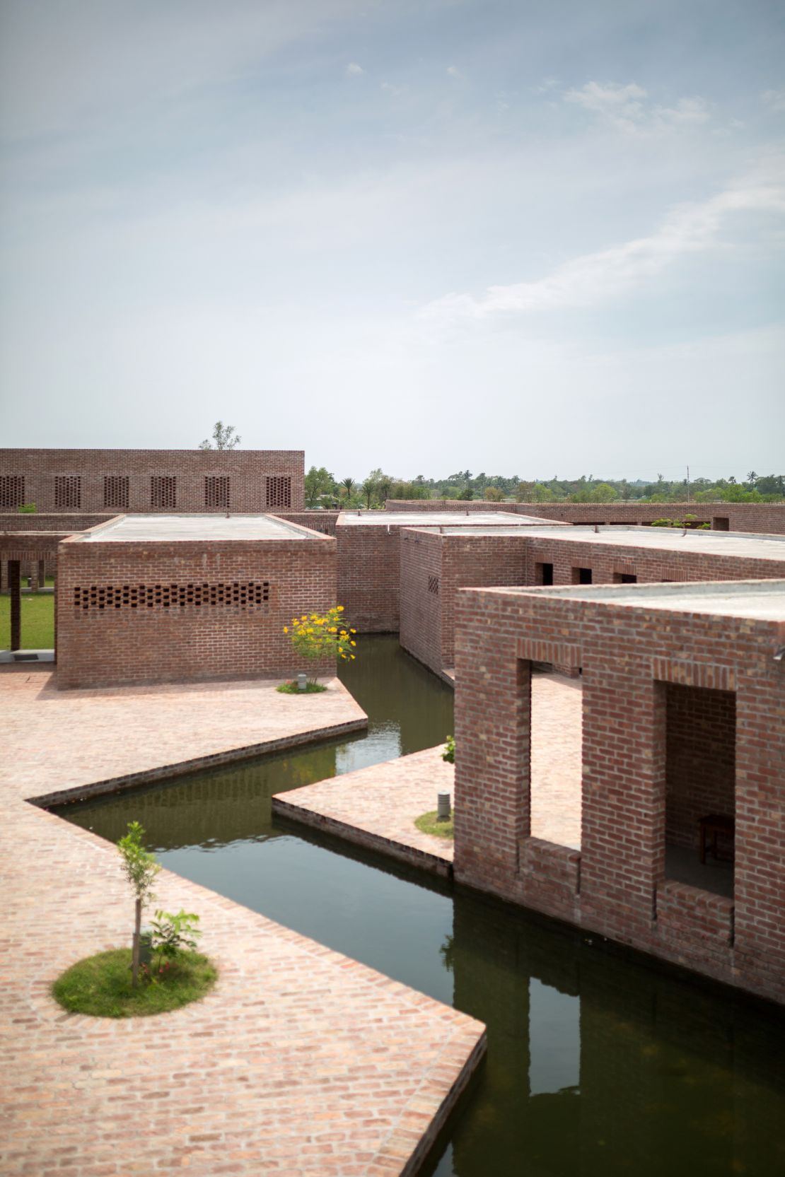 The canal cutting through the center of the complex helps with "micro climatic cooling" during hot Bangladesh summers, according to the Royal Institute of British Architects.
