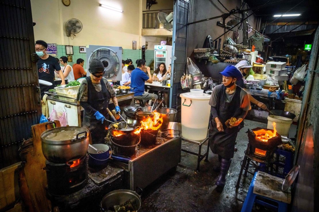 Chef Jay Fai, far left, in her Bangkok restaurant on July 15, 2020.