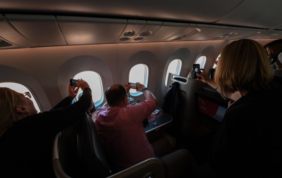 Airlines say flights to nowhere have proven popular with passengers. Pictured here: people onboard Qantas' first flight to nowhere in October 2020. 