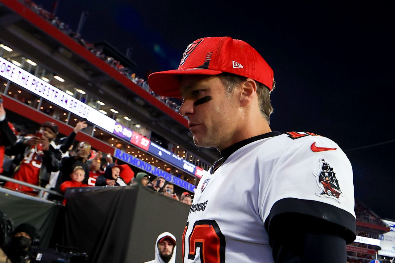 Brady walks off the field after the playoff loss to the Rams.