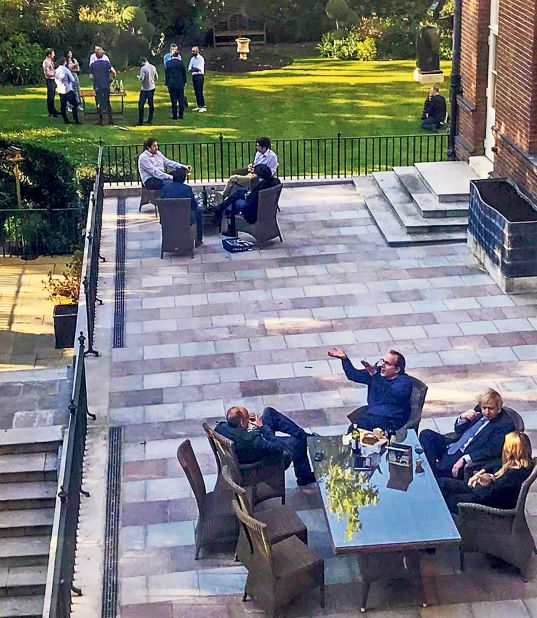 Johnson and staff members are pictured together with wine at a Downing Street garden in May 2020. In January 2022, <a href="index.php?page=&url=https%3A%2F%2Fwww.cnn.com%2F2022%2F01%2F12%2Fuk%2Fboris-johnson-pmqs-downing-street-party-intl-gbr%2Findex.html" target="_blank">Johnson apologized</a> for attending the event, which took place when Britons were prohibited from gathering due to strict coronavirus restrictions.