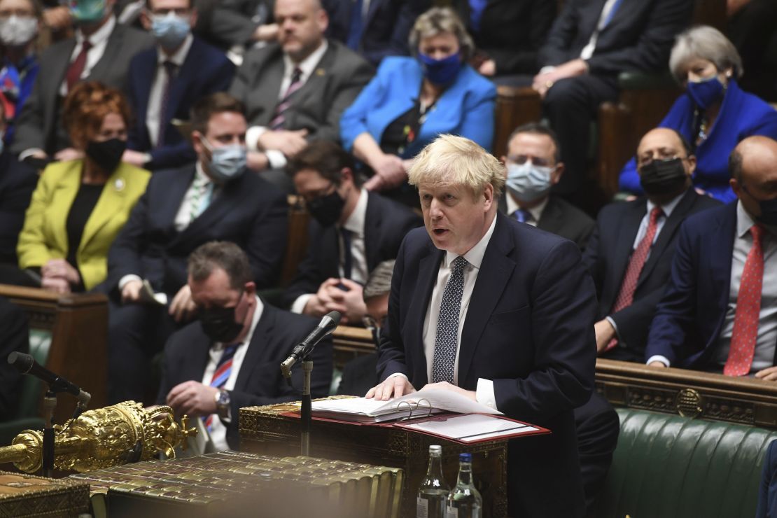 Boris Johnson speaks during Prime Minister's Questions in the House of Commons on January 12, 2022. Johnson apologized for attending a garden party during Britain's first coronavirus lockdown, but brushed aside opposition demands that he resign for breaching his government's rules.