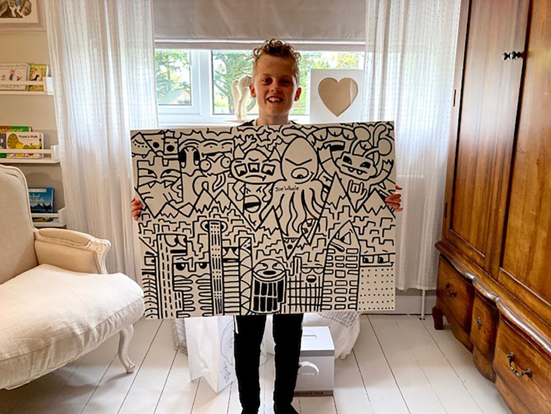 Joe Whale, "The Doodle Boy," with on of his artworks. 