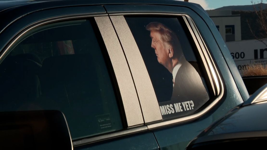 A truck parked outside Paisan's bears an image of former President Trump and the question "Miss Me Yet?"