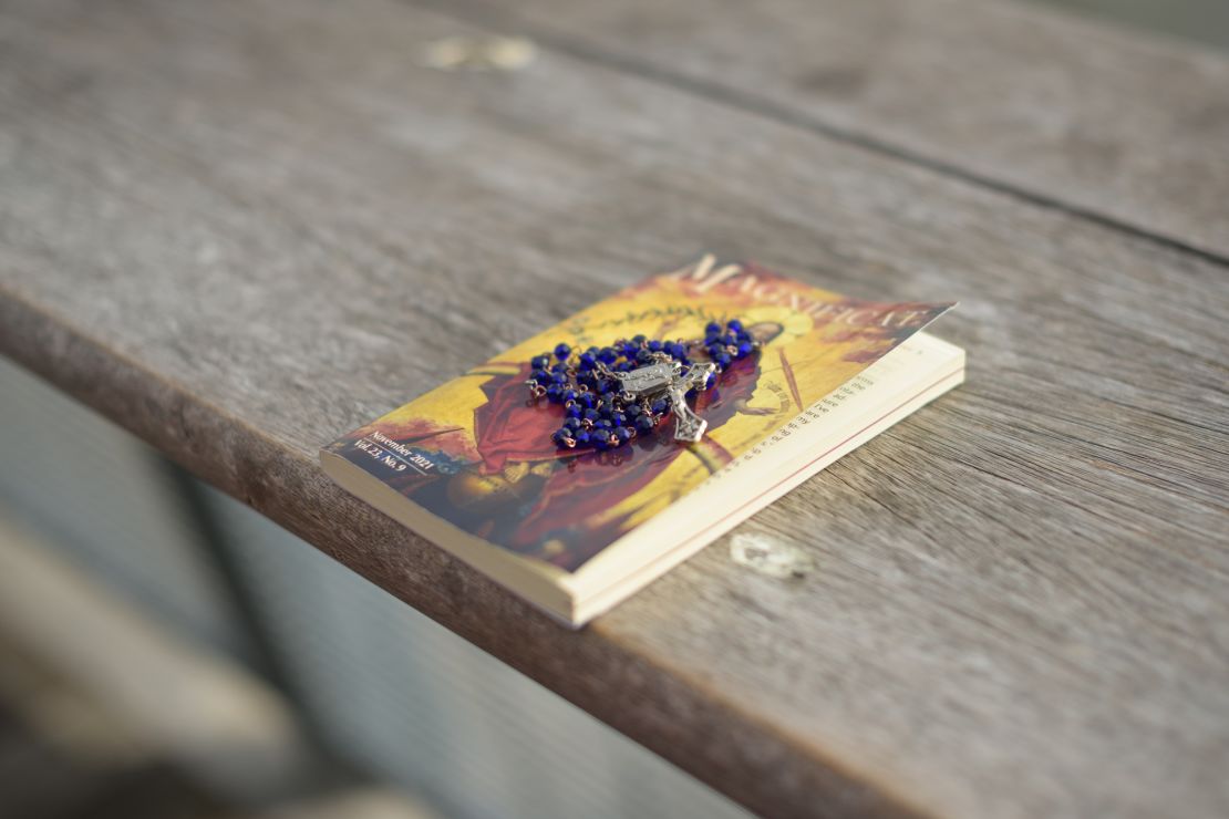 Vilma Kari lays out her rosary and Catholic prayer book.