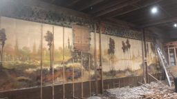 Couple discovers a 60-foot long mural during building renovations.