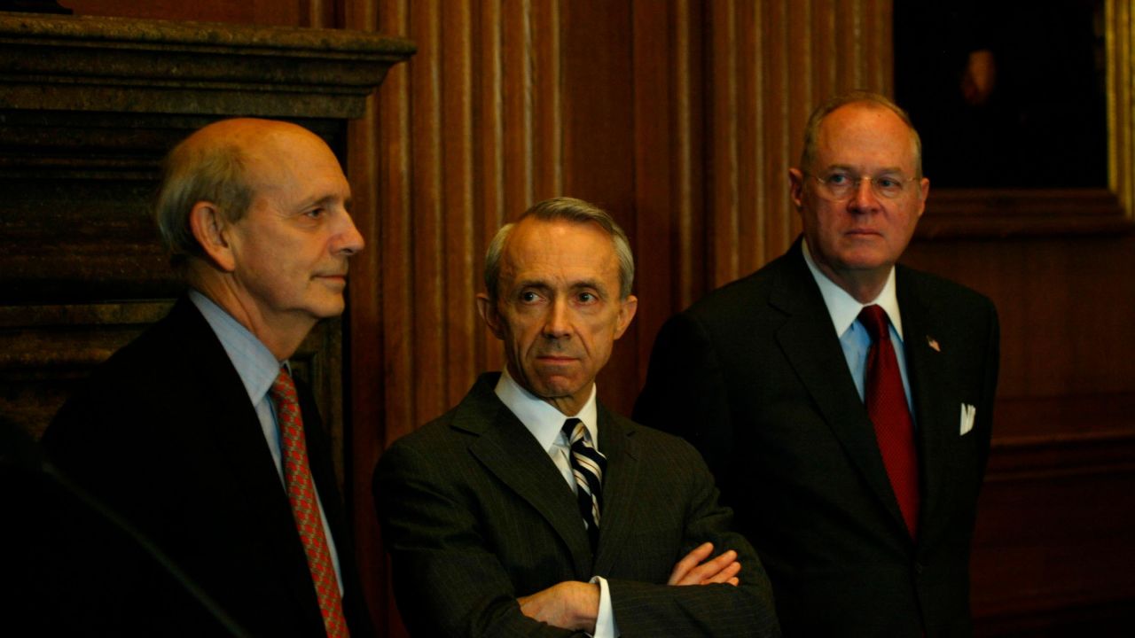 Justices Stephen Breyer (L), David Souter and Anthony Kennedy (R) attend a news conference at the Supreme Court to urge better pay for federal judges May 28, 2003, in Washington.