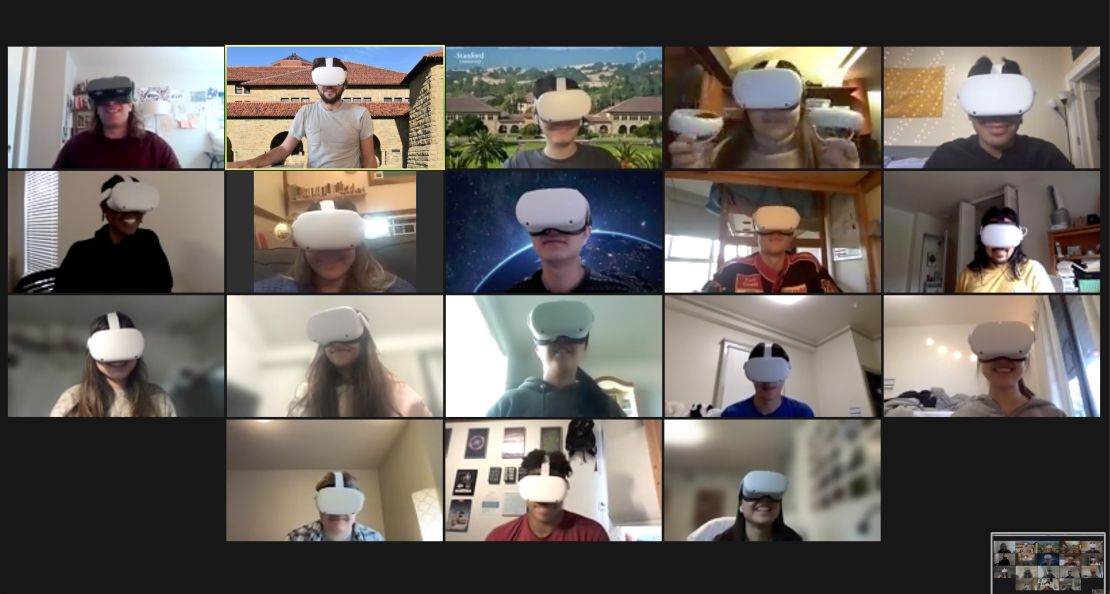 A screenshot of Stanford students participating in a discussion on Zoom while working together collaboratively as avatars in VR.