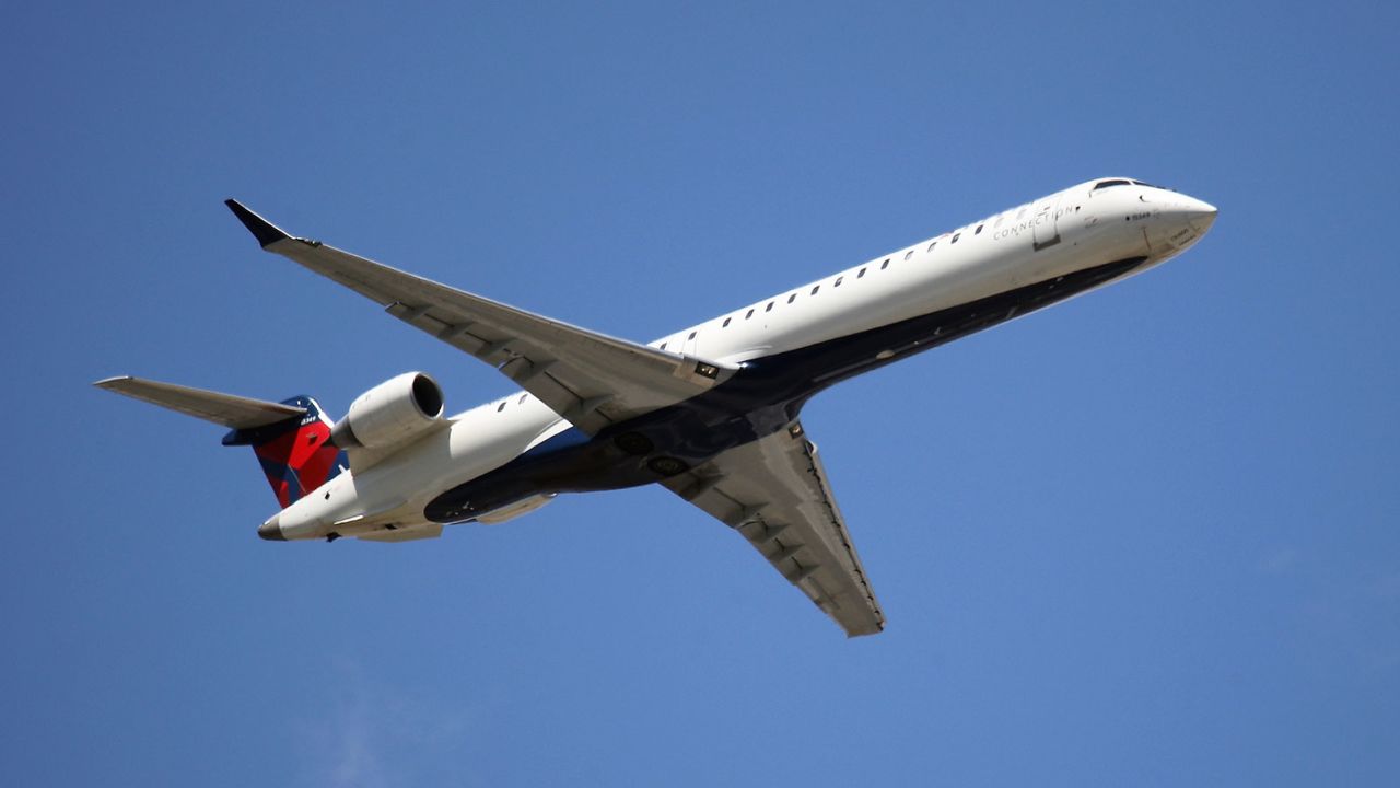 A Bombardier CRJ-900LR operated by Delta Airlines takes off from JFK Airport in 2019. 