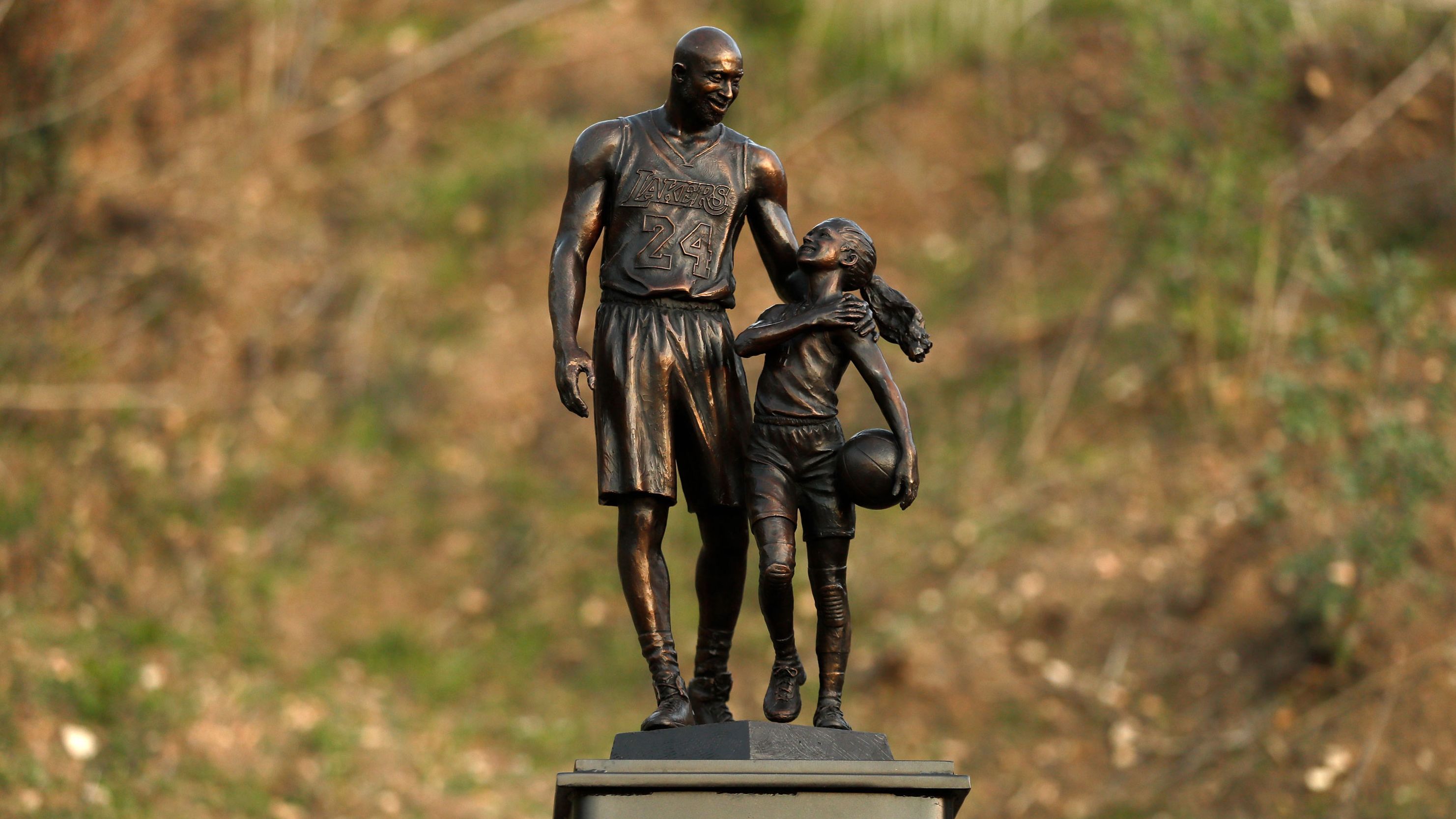 A bronze sculpture of Kobe Bryant and Gianna Bryant is displayed Wednesday in Calabasas, California.