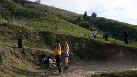 Fans visit a statue to honor former Los Angeles Lakers player Kobe Bryant and his daughter, Gianna, on Wednesday in Calabasas, California.