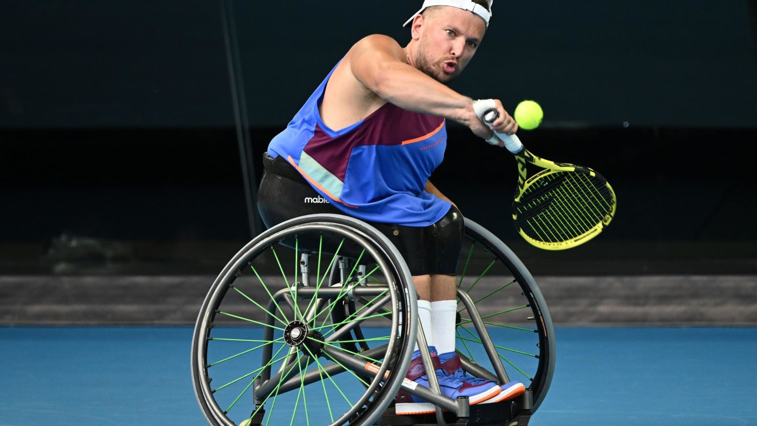 Dylan Alcott plays a backhand in his quad wheelchair singles final against Sam Schroder.
