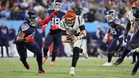 Burrow rushes against the Tennessee Titans during their AFC Divisional Playoff Game.