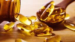 Close up vitamin D and Omega 3 fish oil capsules supplement 