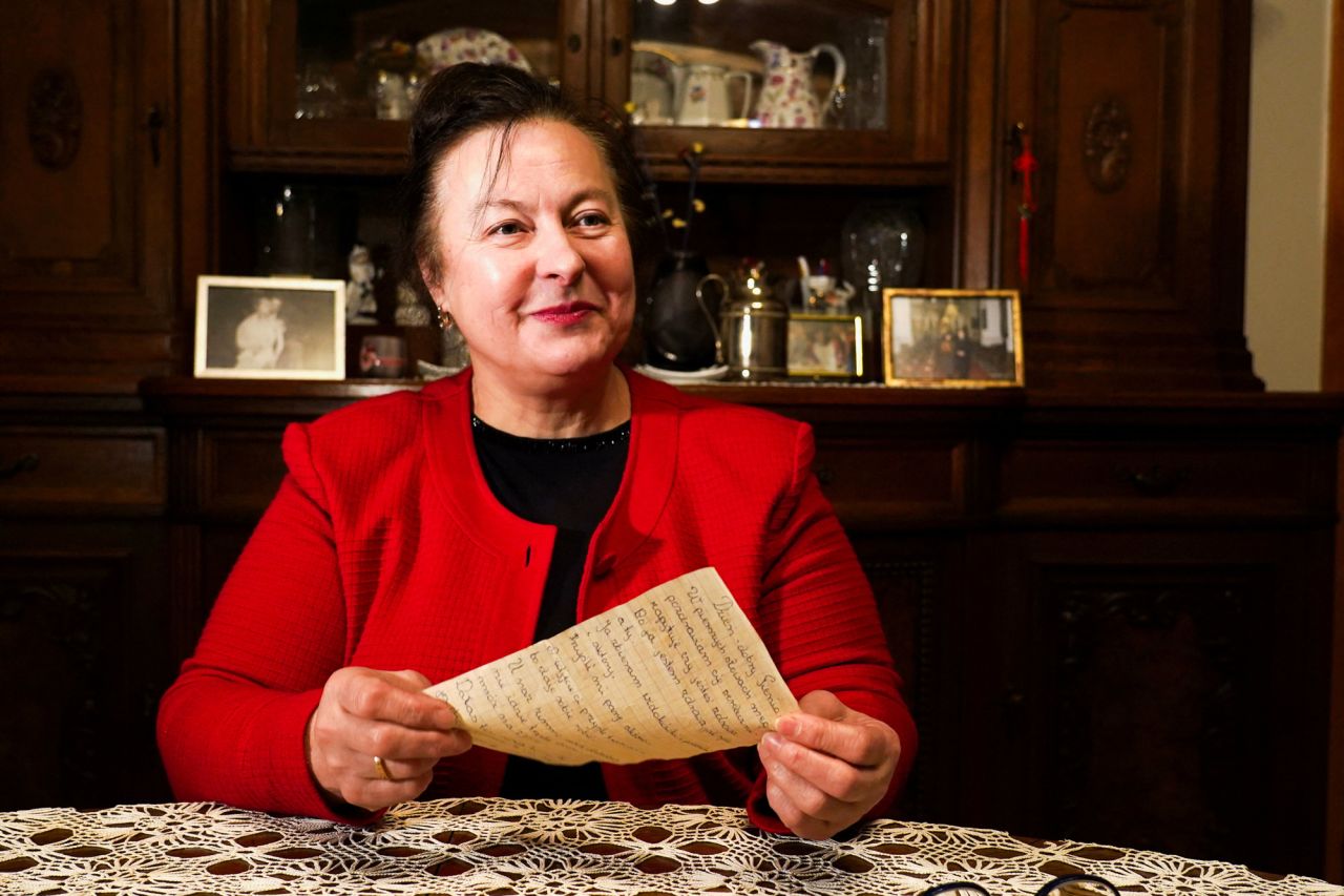 Letter recipient Genovefa Klonovska holds a letter received around 50 years later in Vilnius, Lithuania on Tuesday.