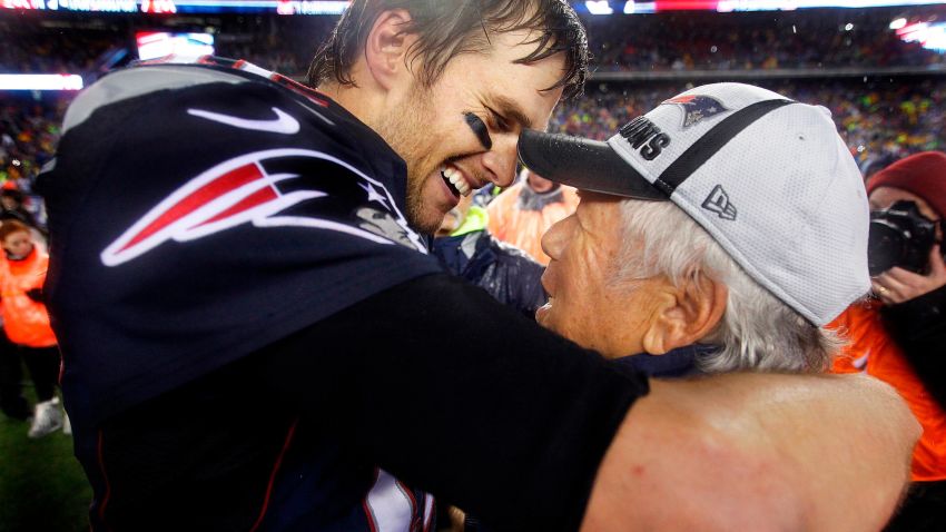 FOXBOROUGH, MA - JANUARY 18: Patriots quarterback Tom Brady is all smiles as he hugs team owner Robert Kraft after New England's romp over the Colts. The New England Patriots hosted the Indianapolis Colts in the AFC Championship Game at Gillette Stadium. (Photo by Jim Davis/The Boston Globe via Getty Images)