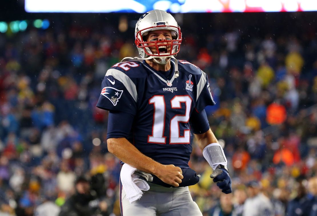 Brady cheers as he runs on to the field before the game against the Pittsburgh Steelers at Gillette Stadium on September 10, 2015.