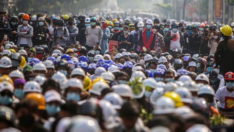 A crowd of protesters listens to speeches during an anti-military coup demonstration in Mandalay on March 7, 2021.  