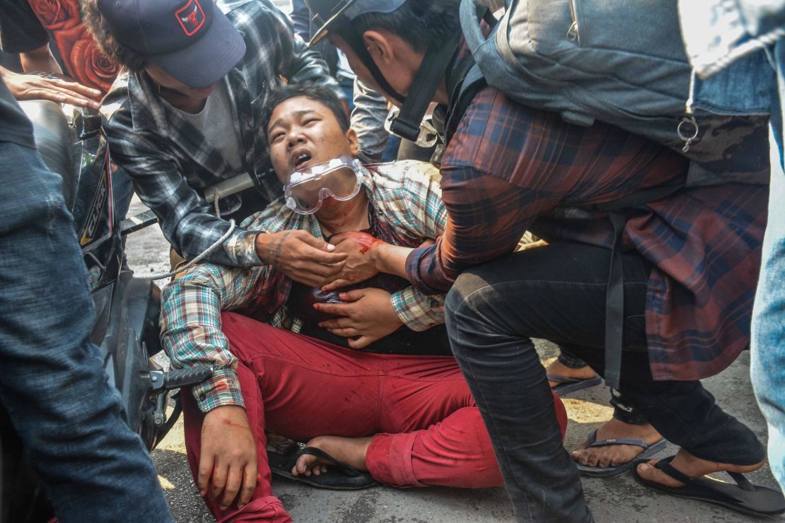 A wounded protester is seen after security forces intervene in protests against the military coup in Mandalay on March 27, 2021.