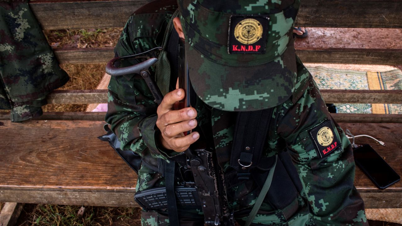 Members of the Karenni Nationalities Defense Force (KNDF) at a checkpoint near Demoso, in Myanmar's eastern Kayah state on October 19, 2021.