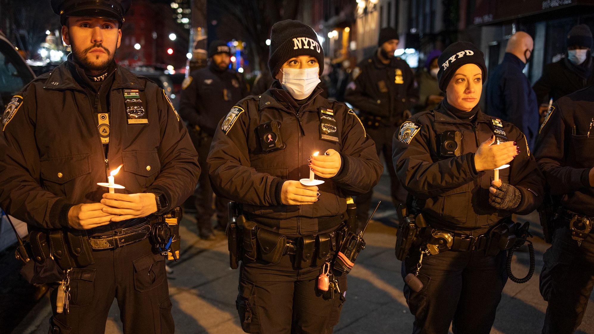 Police officers attend the vigil on January 26.
