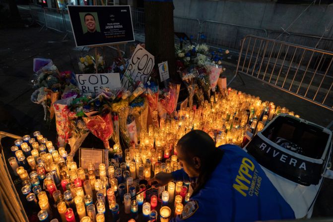 Police officers and other members of the community also held a candlelight vigil at the 32nd Precinct on January 24.