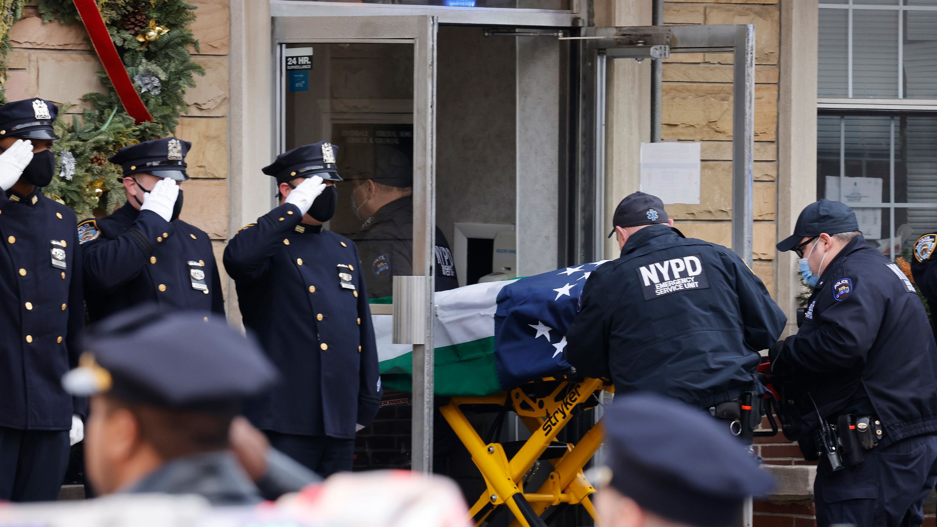 Rivera's body is brought into a funeral home on January 23.