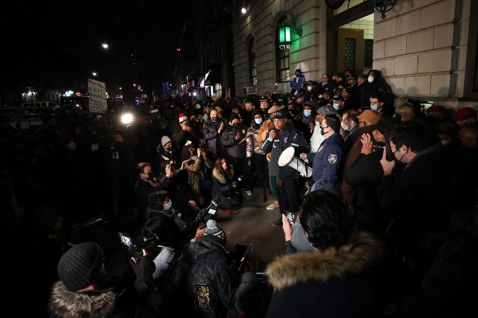 Mayor Eric Adams speaks to police officers and firefighters during a vigil at the 32nd Precinct on January 22.