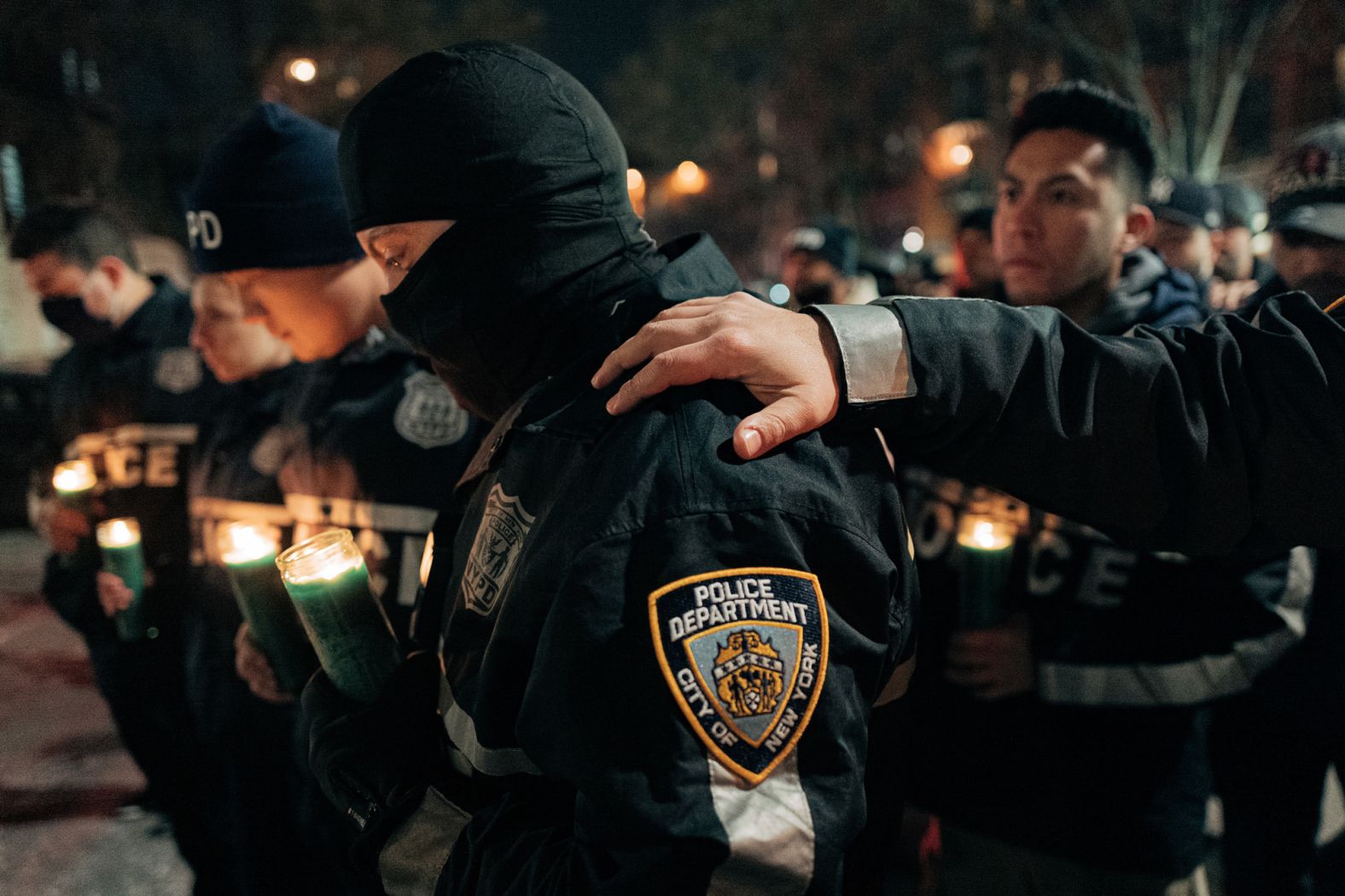 Police officers gather at a vigil on January 22.