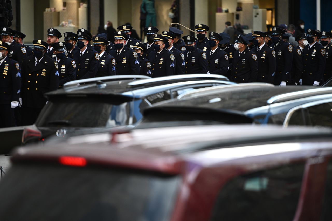 Members of the New York Police Department stand in formation outside St. Patrick's Cathedral as they attend Rivera's wake.