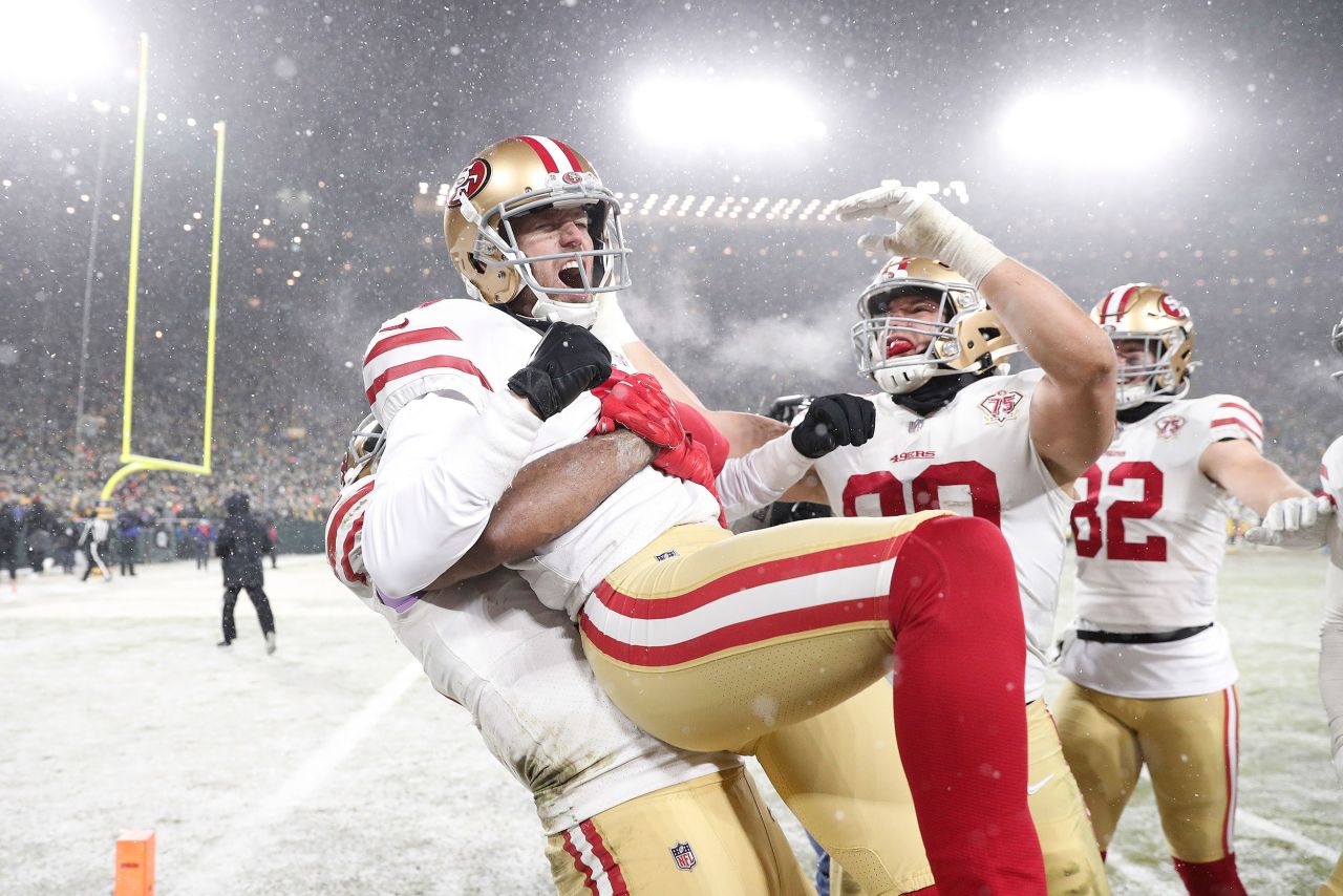 San Francisco kicker Robbie Gould is lifted by a teammate after he kicked a field goal to win an NFL playoff game in Green Bay, Wisconsin, on Saturday, January 22. <a href="https://www.cnn.com/2022/01/23/sport/cincinnati-bengals-san-francisco-49ers-playoffs-spt-intl/index.html" target="_blank">The 13-10 victory</a> moved the 49ers into the NFC Championship game.