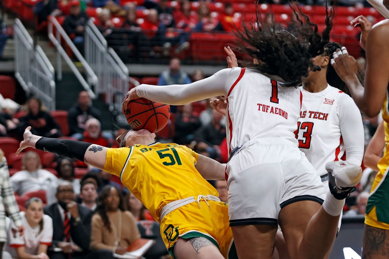 Baylor's Caitlin Bickle is hit in the face with a ball during a college basketball game in Lubbock, Texas, on Wednesday, January 26. Texas Tech's Ella Tofaeono was called for a foul on the play.