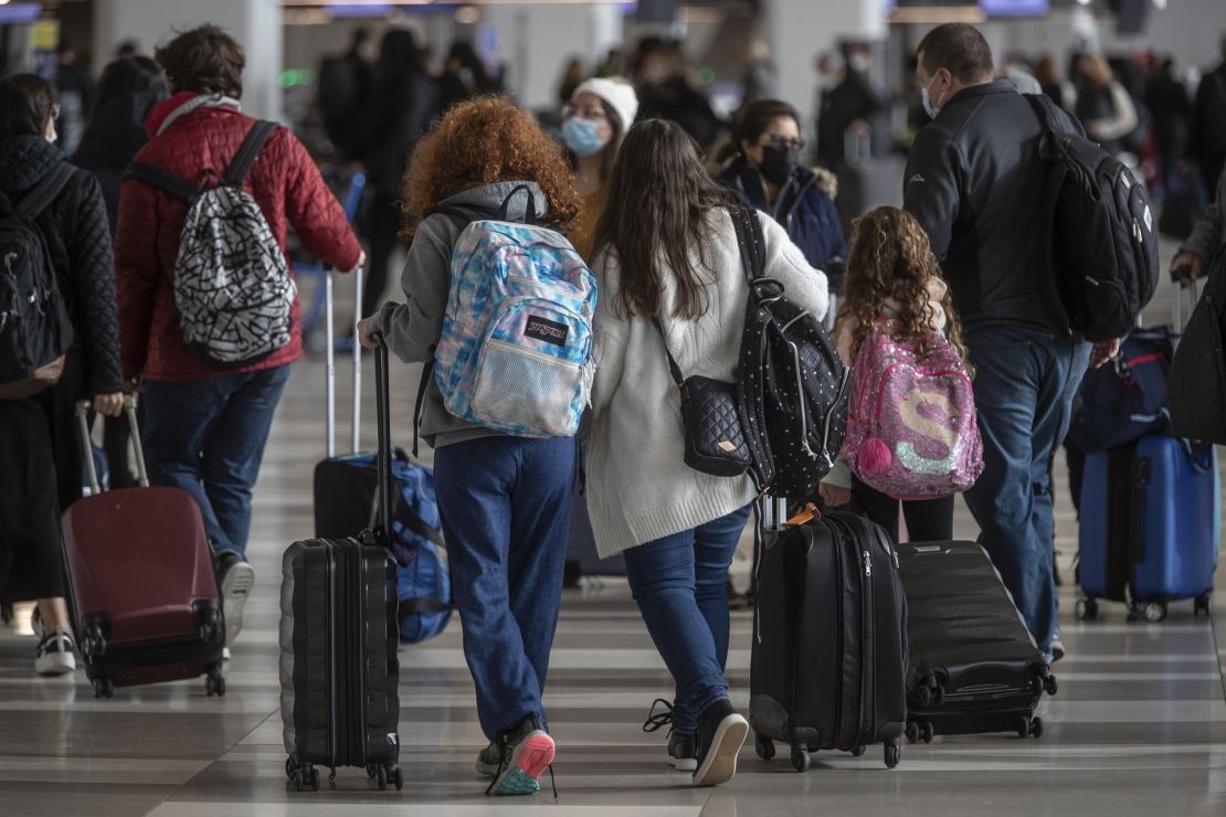 Young travelers at  LaGuardia Airport in Queens, New York, on December 21, 2021. 