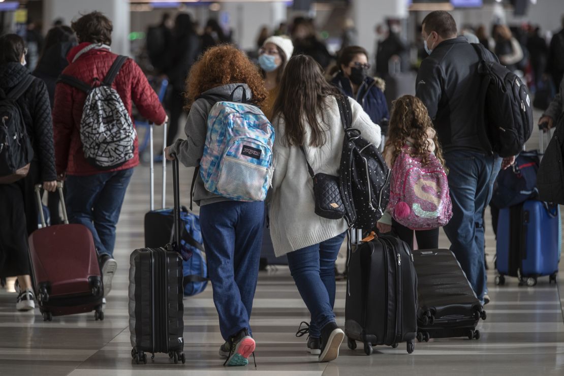Young travelers at LaGuardia Airport in Queens, New York, on December 21, 2021.