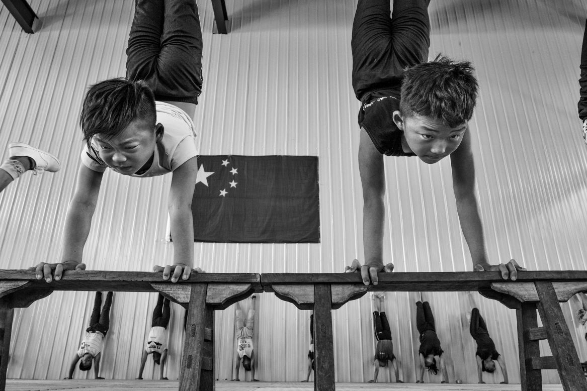 "Double Act," by Li Huaifeng, shows a pair of young acrobats at the Shandong Dezhou Ningjin Acrobat School.