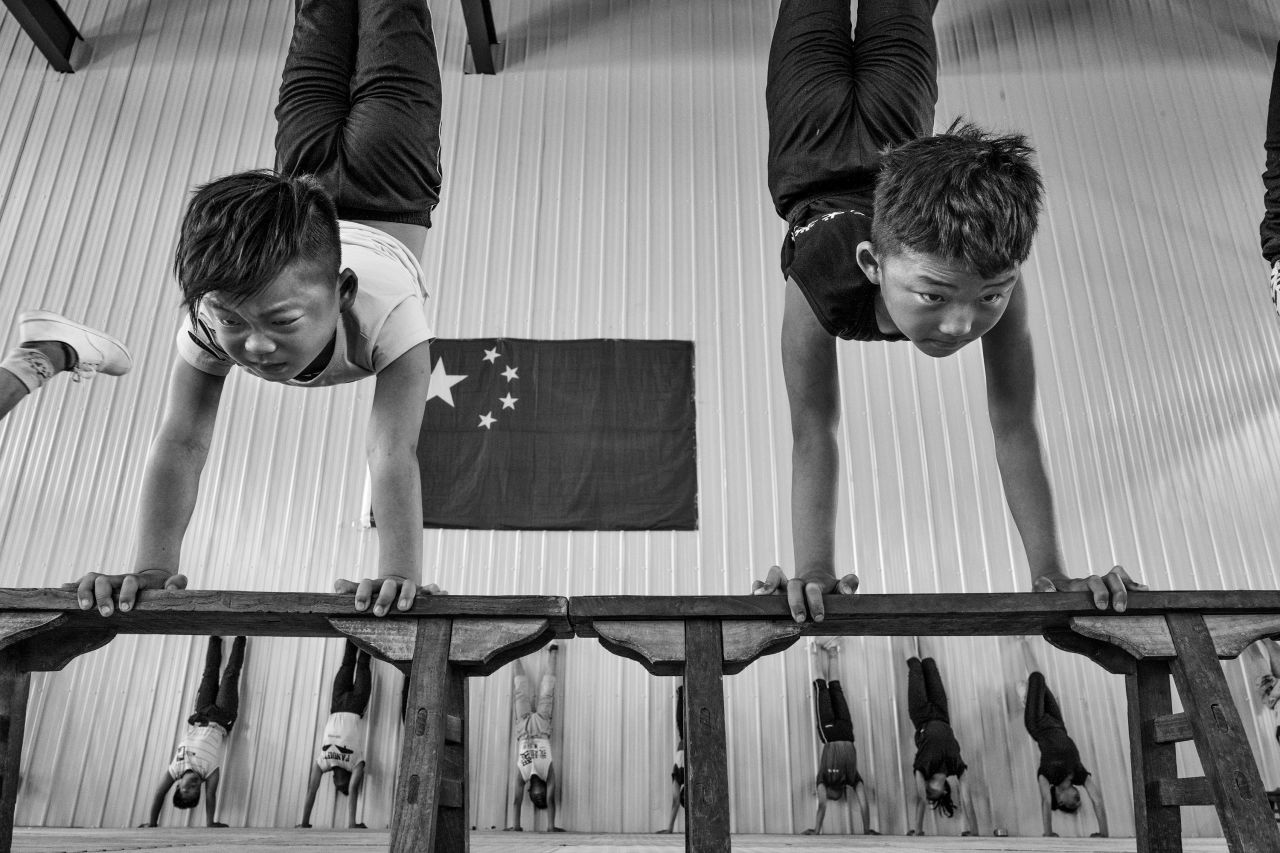 "Double Act," by Li Huaifeng, shows a pair of young acrobats at the Shandong Dezhou Ningjin Acrobat School.