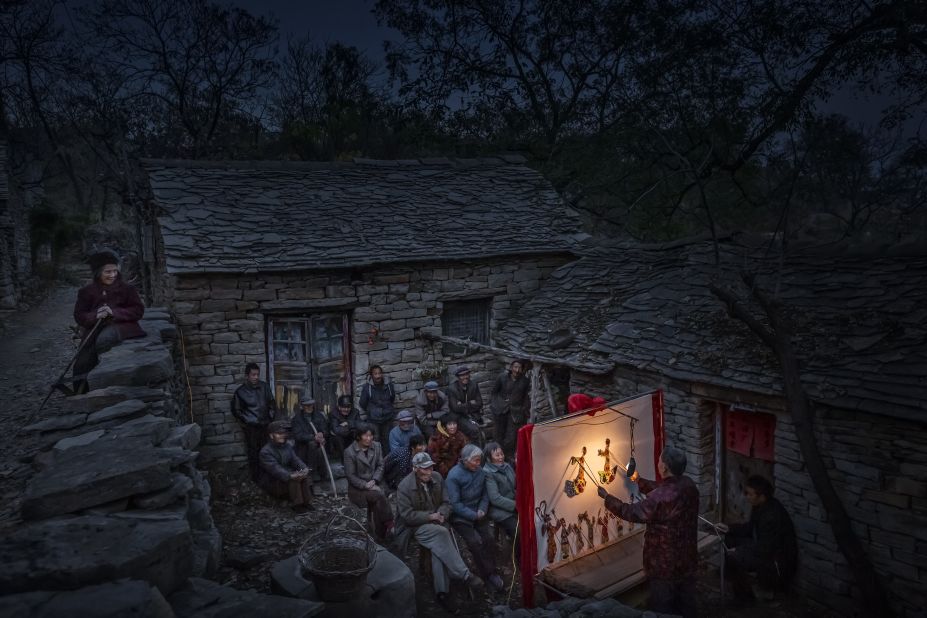 Photographer Li Jianping was highly commended for this 2020 image of a shadow puppet show  in Shandong province.