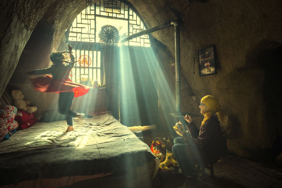 Showing a young girl twirling in front of her grandmother, Chinese photographer Li Huaifeng's image "The Dancing Dreams of a Mountain Girl" was named overall winner.