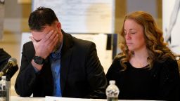 William Myre, his wife Sheri, the parents of Tate More, appear during a news conference in Southfield, Mich., Thursday, Jan. 27, 2022. A new lawsuit alleging negligence by school officials and a Michigan school shooting suspect's parents was filed over the attack at Oxford High School that killed four students and wounded six other students and a teacher. (AP Photo/Paul Sancya)