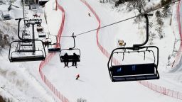 This picture taken on January 12, 2022 shows doctors riding on a lift at the National Alpine Ski Centre, a venue for the Beijing 2022 Winter Olympic Games, in Yanqing, on the outskirts of Beijing. - The world's finest skiers will start competing in the slalom, downhill and Super-G competitions in early February, and the doctors were putting in last minute practice at Yanqing, one of two sites north of China's capital that will host mountain-based events. - TO GO WITH Oly-2022-China-health-ski,FOCUS by Ludovic EHRET (Photo by NOEL CELIS / AFP) / TO GO WITH Oly-2022-China-health-ski,FOCUS by Ludovic EHRET (Photo by NOEL CELIS/AFP via Getty Images)