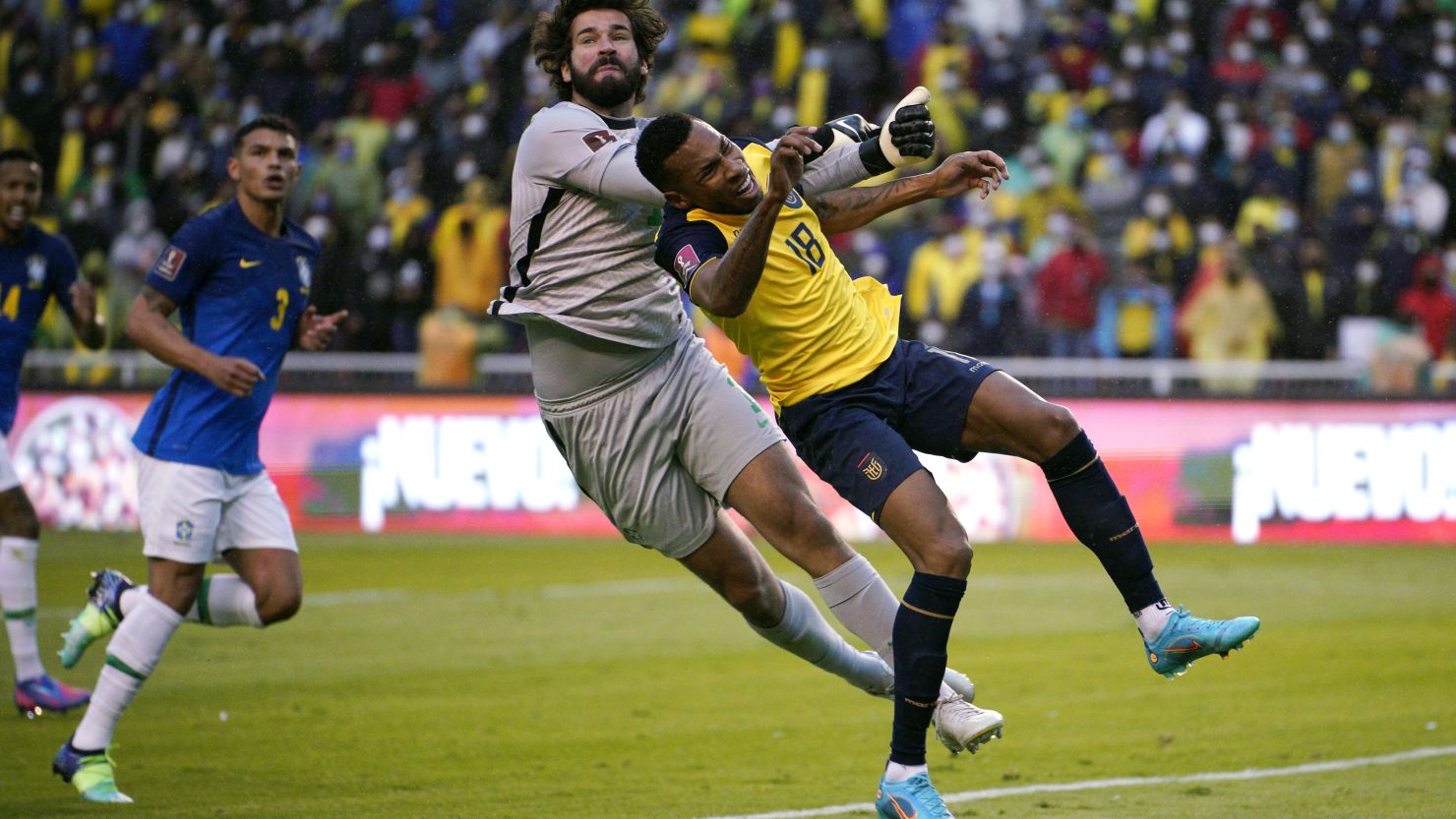 Alisson Becker of Brazil collides with Ayrton Preciado of Ecuador during the World Cup 2022 qualifiers at Rodrigo Paz Delgado Stadium on January 27, 2022 in Quito, Ecuador.