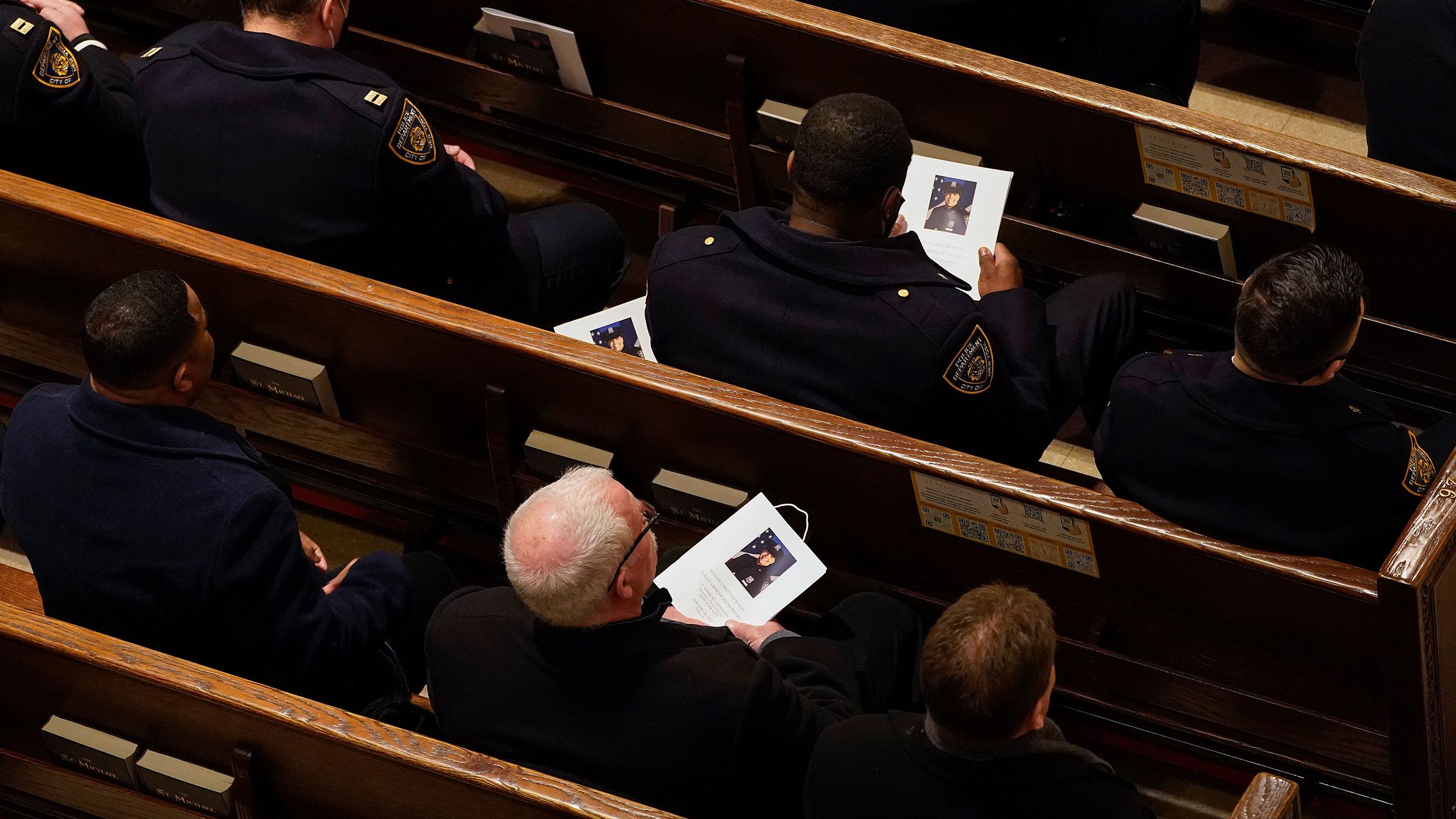 Police officers attend Rivera's funeral inside St. Patrick's Cathedral.