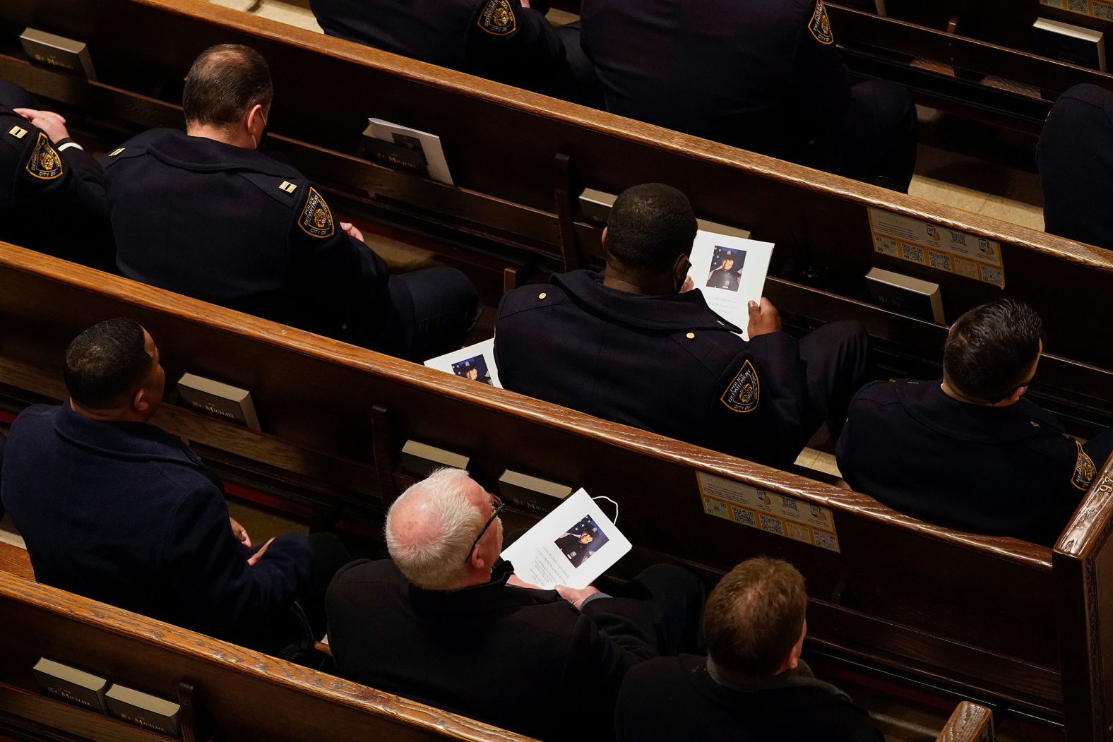 Police officers attend Rivera's funeral inside St. Patrick's Cathedral.