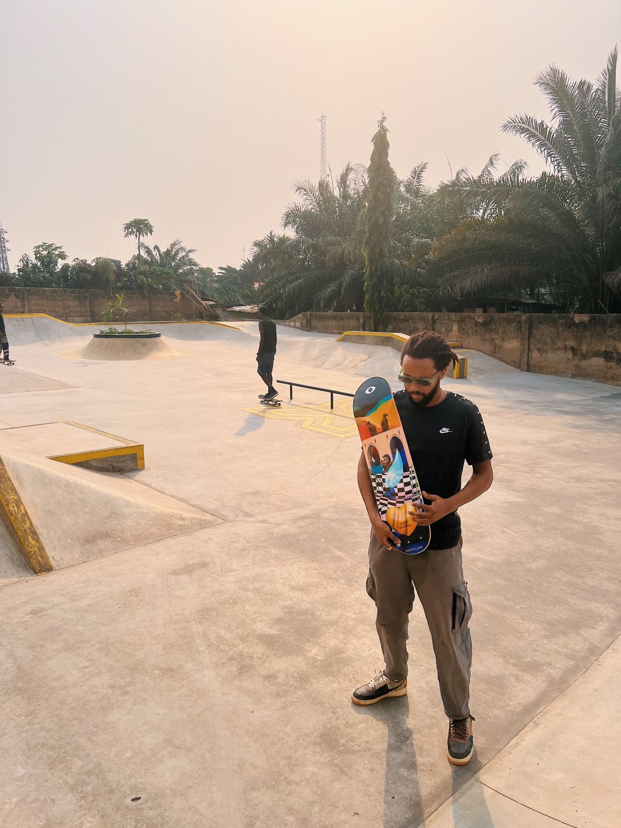David Alabo (pictured) holds one of his limited edition skateboard designs at the recently opened Freedom Skate Park in Accra, Ghana. 