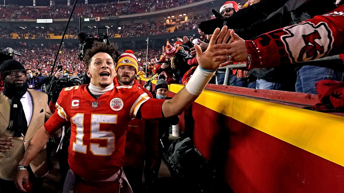 Chiefs QB Patrick Mahomes celebrates with fans after Kansas City's dramatic OT win against the Buffalo Bills.