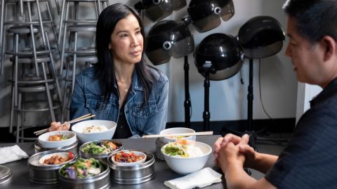 Lisa Ling samples Vietnamese food in the student break room at Advance Beauty College with owner Tam Nguyen in the third episode of her new show, "Take Out With Lisa Ling."
