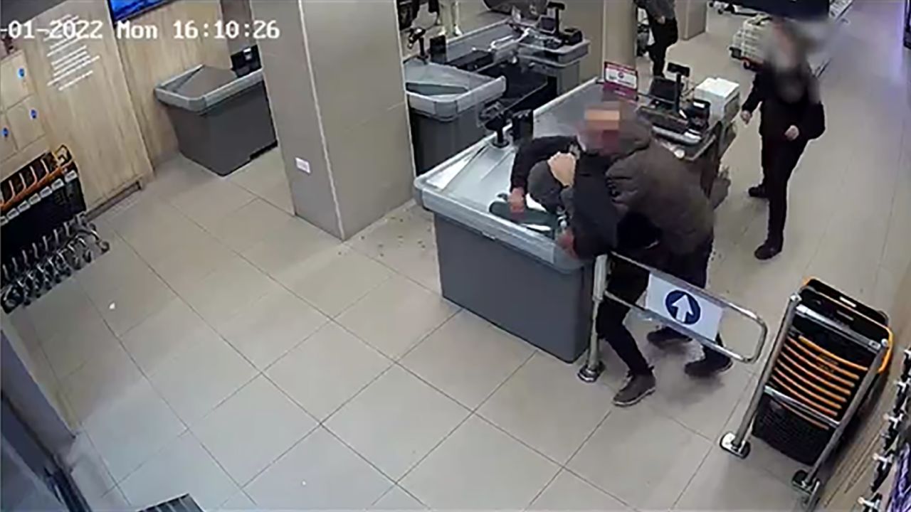 Video shows off-duty police officer stopping armed robbery in progress near Barcelona, in Mataró, Spain. People blurred by source.