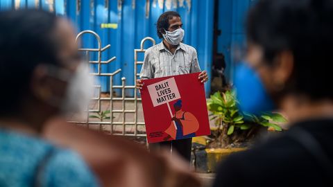 An activist protests against the alleged gang-rape and murder of a caste-oppressed, teenage woman in Mumbai on October 6, 2020.