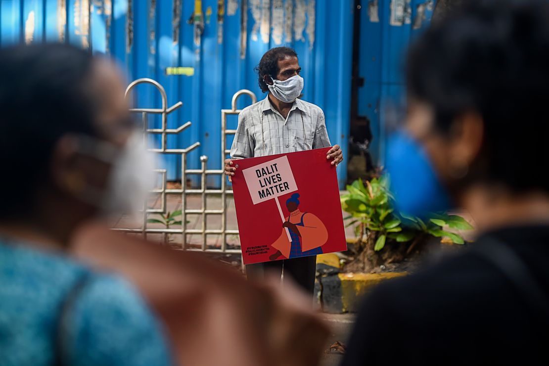 An activist protests against the alleged gang-rape and murder of a caste-oppressed, teenage woman in Mumbai on October 6, 2020.