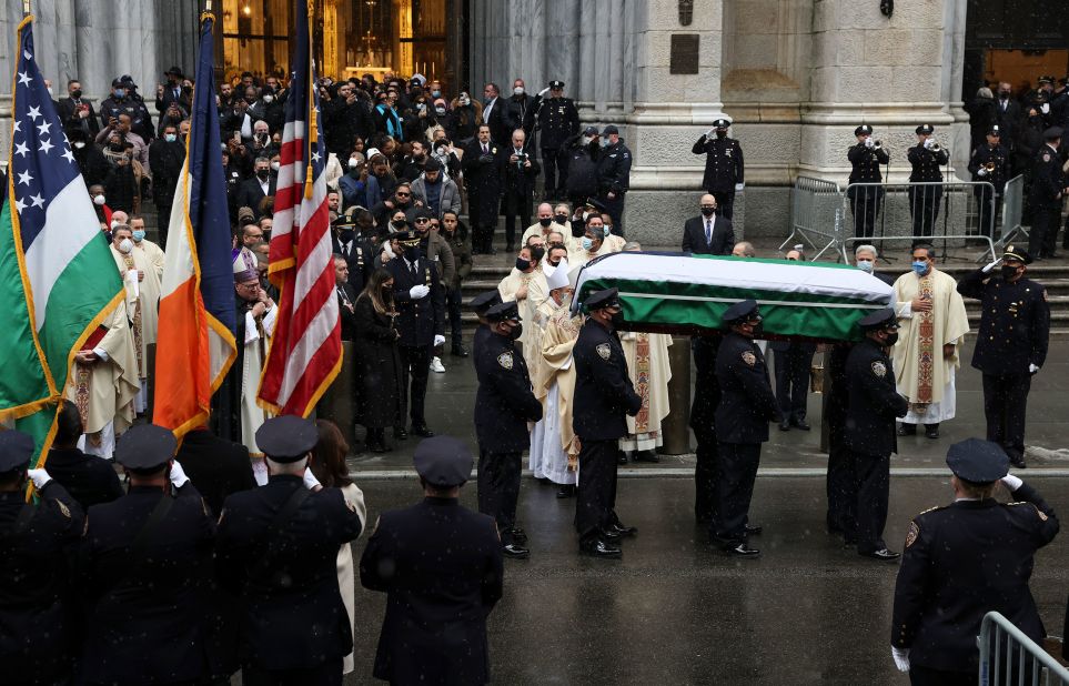 Rivera's casket is carried to a hearse outside St. Patrick's Cathedral after his funeral service.